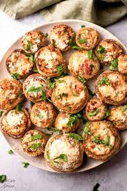 These creamy garlic feta-stuffed mushrooms are the perfect bite-sized appetizer! Easy to make, oven-baked or air-fried, and bursting with Mediterranean flavor.