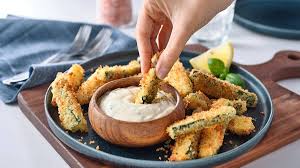 These crispy baked zucchini fries are a healthy and delicious snack or side dish. Paired with a creamy garlic yogurt dip, they’re low-carb, easy to make, and family-friendly
