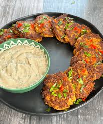 These Moroccan-spiced carrot fritters are crispy, flavorful, and served with a tangy harissa yogurt dip. Perfect vegetarian snack or appetizer, ready in just 30 minutes!