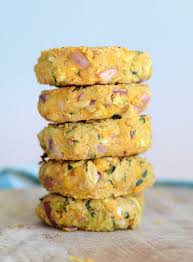 These crispy zucchini and chickpea patties are vegan, gluten-free, and full of fresh herbs and flavor. Served with a creamy lemon-tahini sauce, they're perfect for healthy lunches or meal prep.